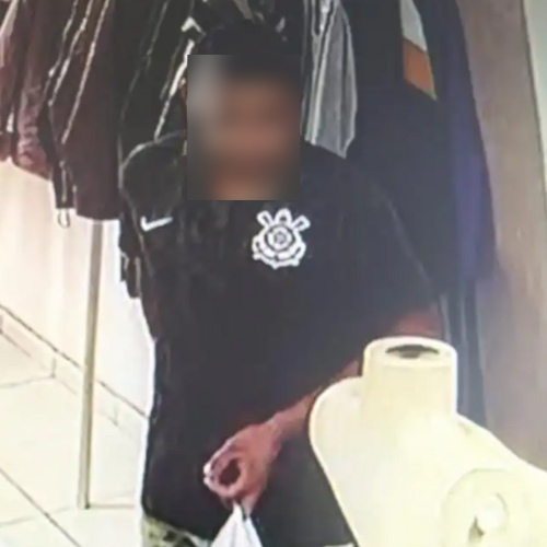 Homem compra jaqueta e paga com notas falsas. foto desfocada do homem